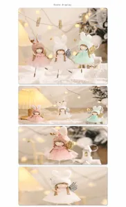 Close-up of plush Christmas angel dolls with rabbit ears and sequined wings in scene display