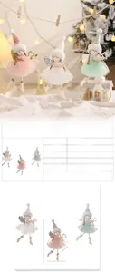 Detail of Christmas angel doll ornaments in pink, white, and mint green colors