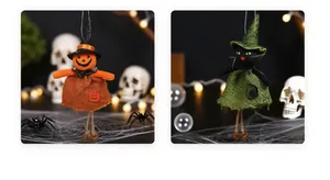 Detail of Halloween pumpkin and black cat doll ornaments with witch hats and burlap skirts