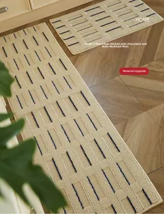 Absorbent cream kitchen floor mat with dark blue stripes on herringbone wood floor