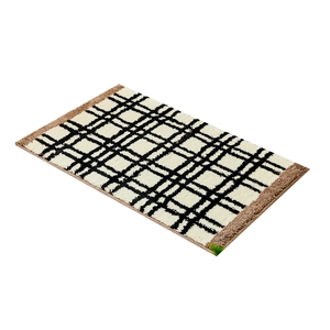 Dik pluche Bauhaus badmat met zwart-wit ruitpatroon en bruine randen van imitatiebont