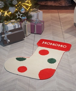 Detailed view of flocked Christmas stocking rug with HOHOHO text in festive room setting