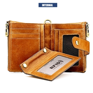 Macro detail of brown crazy horse leather wallet with RFID card slots and zippers