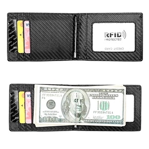 Macro detail of carbon fiber RFID wallet showing card slots and integrated money clip