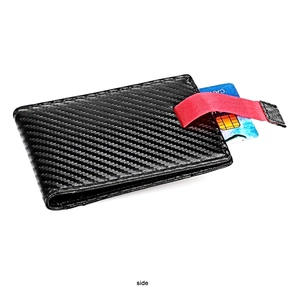 Side view of slim carbon fiber wallet with functional red pull tab for card retrieval