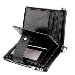 Detailed interior of black leather wallet showing card slots and zipper pocket