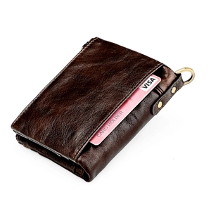 Detail of dark brown leather wallet with RFID card slot and antique bronze metal ring