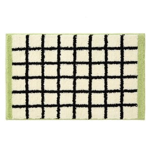 Minimalist Bauhaus style tufted rug with black and white grid and green borders