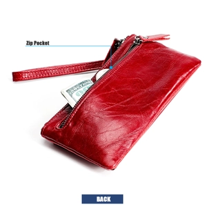 Detail of red leather long wallet featuring a rear zip pocket and matching wrist strap
