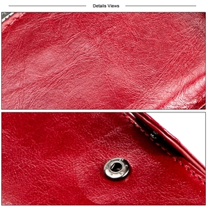 Close-up of dark red genuine leather texture with neat stitching and silver metal button