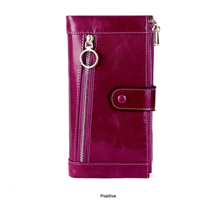 Detail of magenta oil wax leather wallet with decorative zipper and white contrast stitching