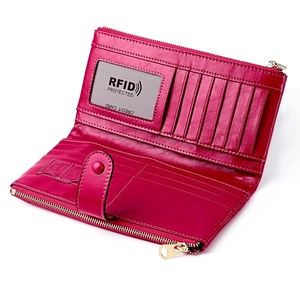 Detail of rose red leather wallet with RFID protection slots and zipper compartment