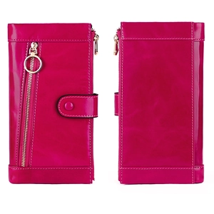 Detailed view of hot pink leather clutch wallet with white contrast stitching and zip pocket