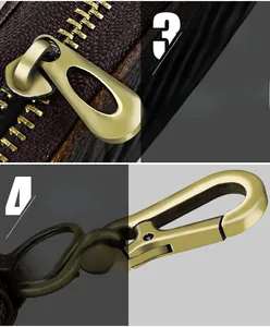 Close-up of smooth golden zipper and durable metal hook on brown leather car key pouch