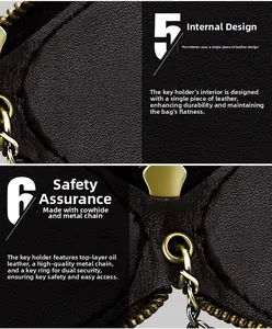 Macro detail of the dark brown genuine leather car key case with golden metal hardware and zipper