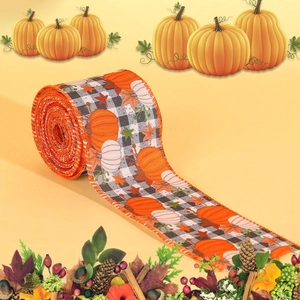 Close-up of harvest plaid ribbon with pumpkin patterns and orange stitched edges