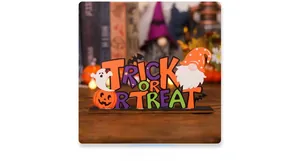 Detail of wooden Halloween gnome centerpiece with Trick or Treat lettering and pumpkins