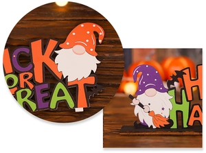 Detail of wooden Halloween gnomes with Trick or Treat lettering for festive table decor