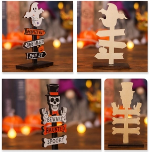 Close-up of Halloween wooden signs with ghost and skull prints on a black base