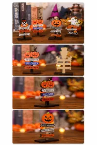 Close-up of Halloween wooden road signs with pumpkin and ghost motifs on a tabletop