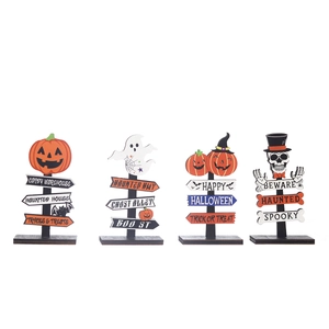 Wooden Halloween signs featuring pumpkin, ghost, and skeleton desktop decorations