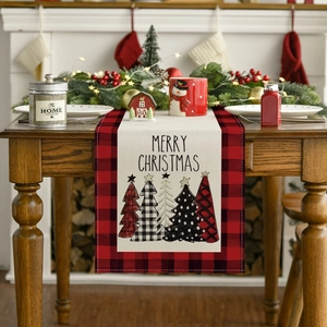 Red buffalo plaid Christmas table runner with Merry Christmas text and festive pine tree motifs