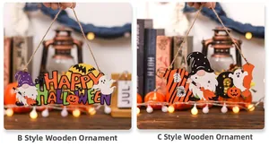 Dettaglio di pendenti in legno per Halloween con scritte festive e decorazioni a tema zucca