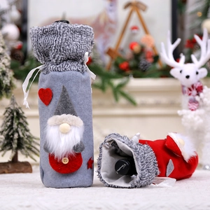 Christmas gnome wine bottle covers with faux fur trim and knitted star patterns