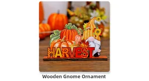Detail of wooden gnome harvest decor with orange pumpkins and cutout lettering
