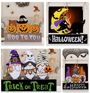 Detail of wooden Halloween gnomes and pumpkins table decor with Trick or Treat prints