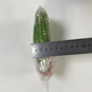 Detailed view showing the 45mm thickness of the green plush mascot toy with a ruler