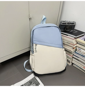 Three-color nylon business backpack detail with slanted zipper and elastic side pockets