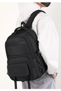 Side view of black ergonomic business backpack showing padded straps and multi-layer storage