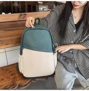 Close-up of three-color nylon business backpack with waterproof fabric and side pockets