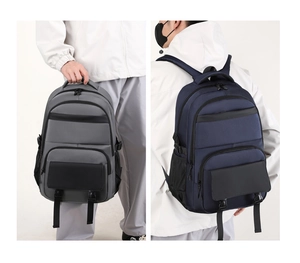 Detail showing side-by-side gray and navy blue multi-functional business backpacks
