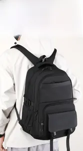 Ergonomic black business backpack with S-shaped straps shown on a male model back