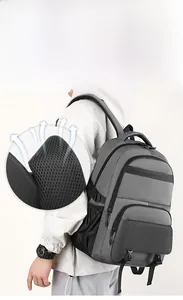 Detail of ergonomic honeycomb mesh shoulder straps on grey business laptop backpack