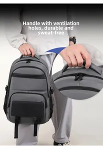 Detail of the breathable padded handle on a durable grey business laptop backpack