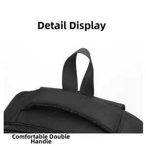 Detail of padded top handle and hanging loop on high-density black nylon business backpack