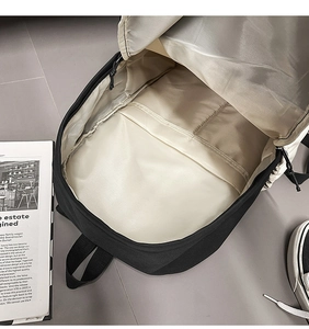 Top view of open business backpack with beige lining and internal divider compartment