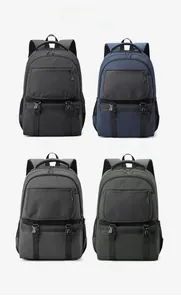 Detail view of multi-compartment backpacks in black, blue, gray, and green colors
