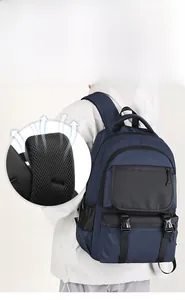 Detail of wide breathable honeycomb mesh shoulder straps on a navy business backpack
