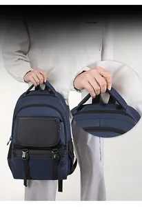 Detail of the breathable mesh handle on the durable dark blue nylon commuter backpack
