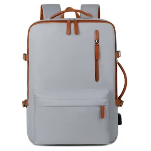 Light gray business casual laptop backpack with USB port and brown leather trim details