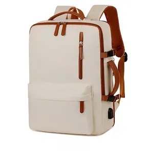Detail of off-white laptop backpack featuring brown leather trim and external USB port