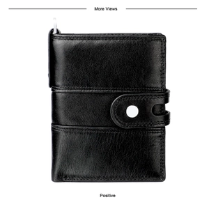Detail of black top grain leather wallet featuring litchi texture and secure snap button