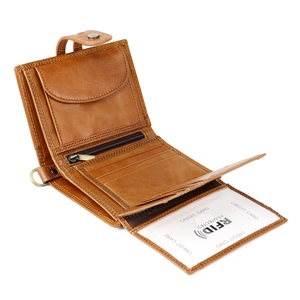 Detail view of brown leather wallet with RFID blocking slots and a coin pocket