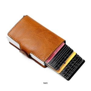 Back view of brown lychee leather RFID wallet with pop-up metal card slot and snap button