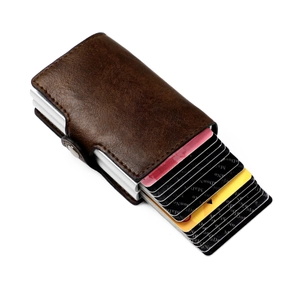 Detail view of brown textured leather RFID wallet with pop-up aluminum card holder mechanism