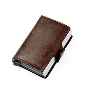 Brown vintage leather RFID wallet detail showing metal card slot and button closure